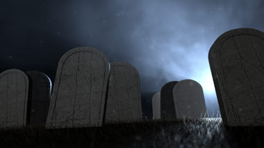 backlit tombs in a graveyard with fog