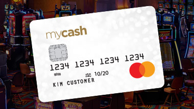 mycash mastercard credit card with lowered opacity slot machines in the background