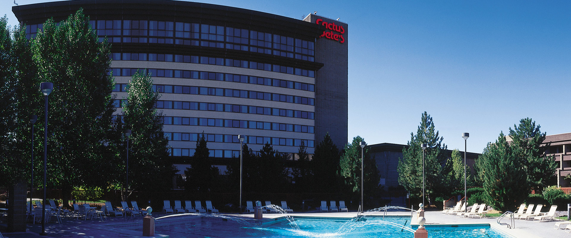 Exterior of Cactus Petes Resort Casino and its outdoor swimming pool in Jackpot, Nevada