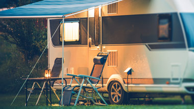 Camper with Awning and 2 camper chairs